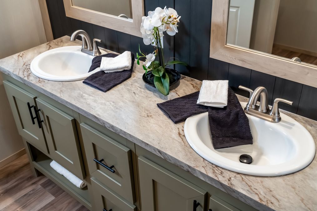 The RAINIER Exterior. This Manufactured Mobile Home features 4 bedrooms and 3 baths.