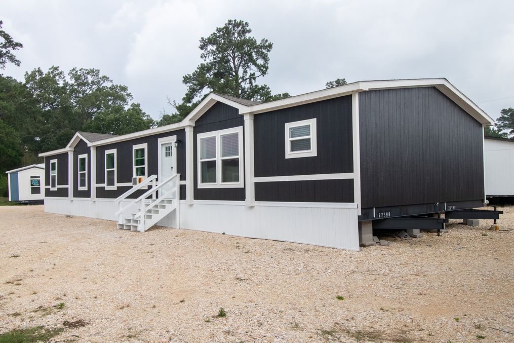 The BREEZE FARMHOUSE 72 Exterior. This Manufactured Mobile Home features 4 bedrooms and 2 baths.