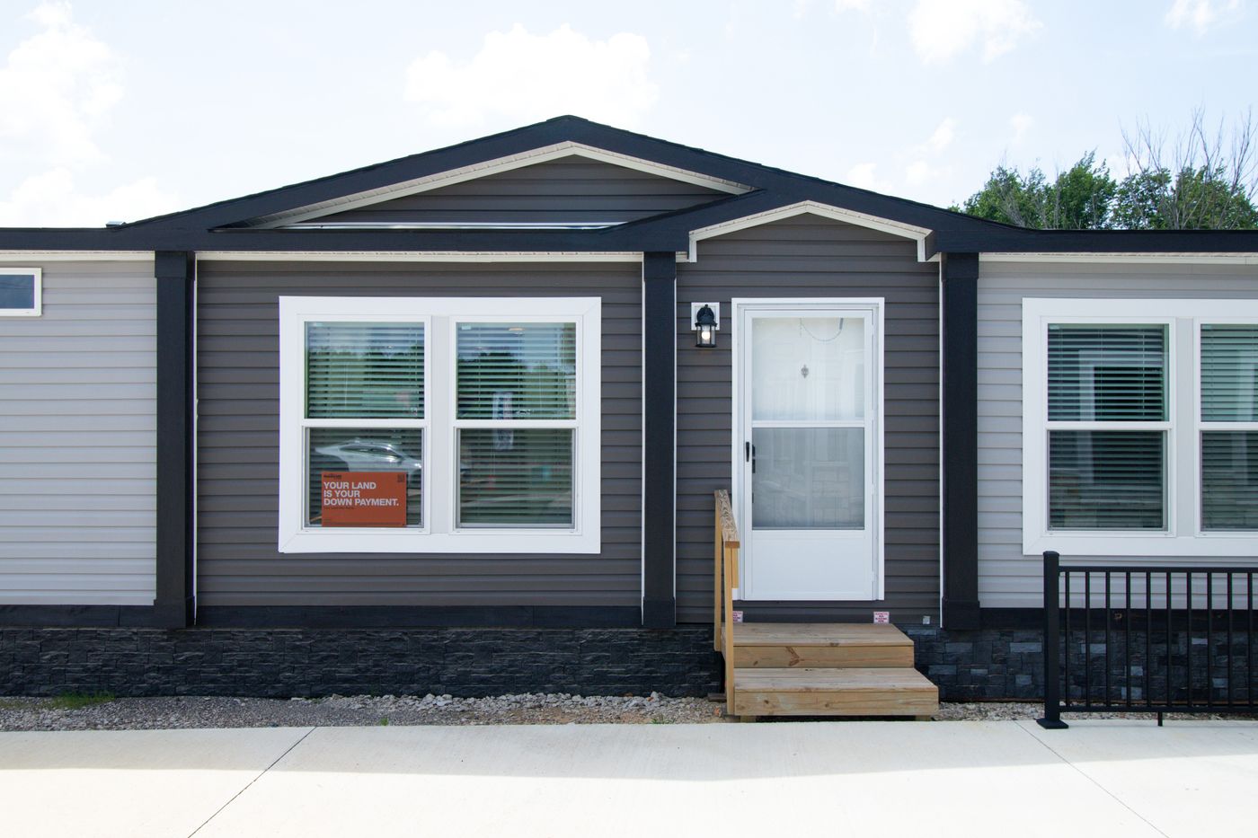 The THE REAL DEAL Exterior. This Manufactured Mobile Home features 3 bedrooms and 2 baths.