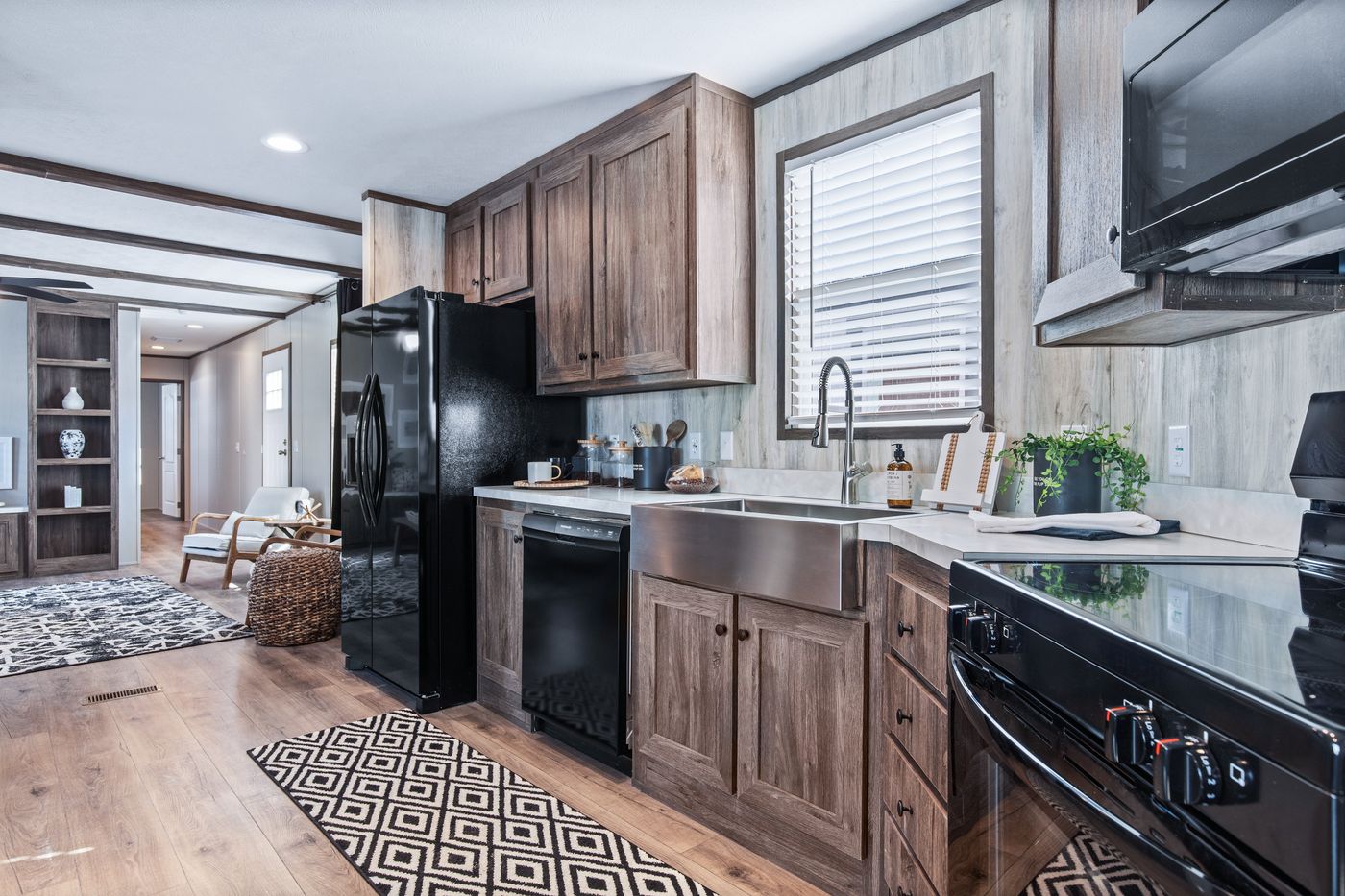 The ANNIVERSARY 16763F Kitchen. This Manufactured Mobile Home features 3 bedrooms and 2 baths.