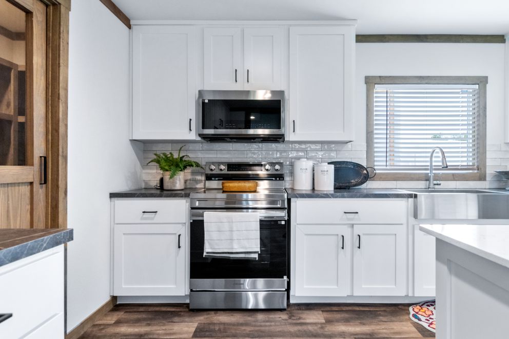 The FARM 3 FLEX ELITE DEN Exterior. This Manufactured Mobile Home features 3 bedrooms and 2 baths.
