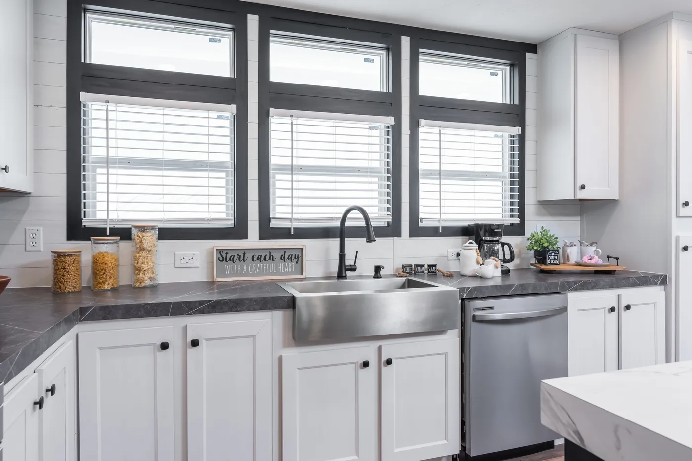 The ABSOLUTE VALUE Kitchen. This Manufactured Mobile Home features 4 bedrooms and 2 baths.