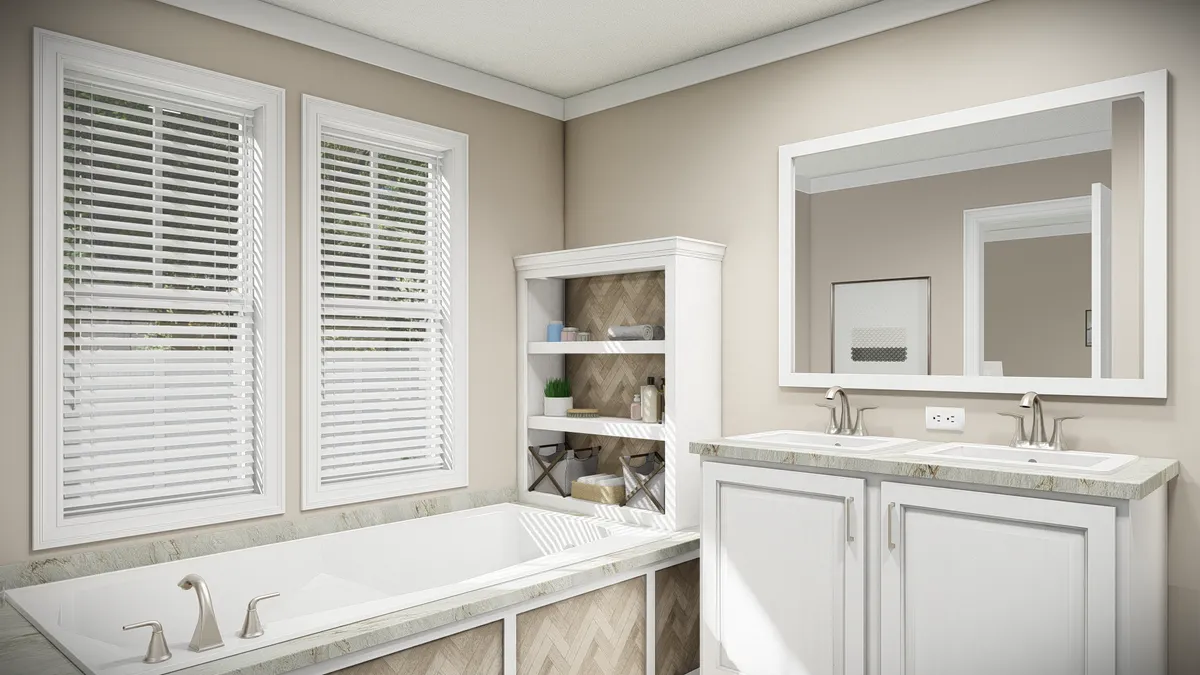 The THE DREAM Primary Bathroom. This Manufactured Mobile Home features 3 bedrooms and 2 baths.