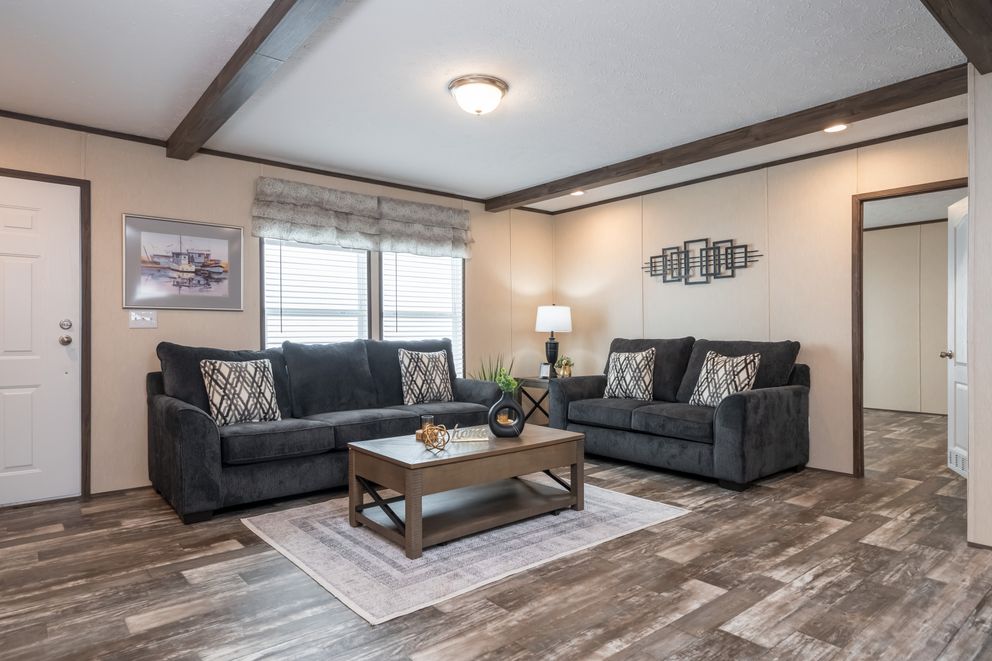 The HARDIN Living Room. This Manufactured Mobile Home features 3 bedrooms and 2 baths.