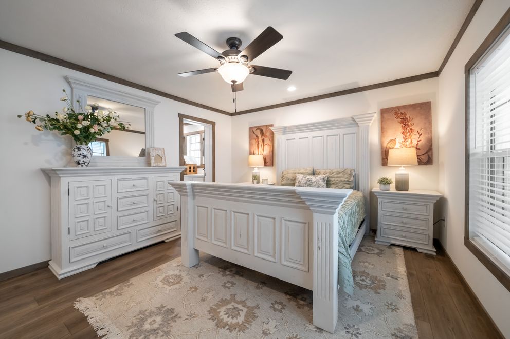 The THE LIZZIE Primary Bedroom. This Manufactured Mobile Home features 3 bedrooms and 2 baths.