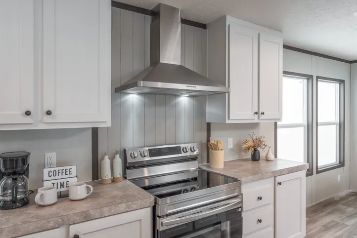 The EMPOWER Kitchen. This Manufactured Mobile Home features 4 bedrooms and 2 baths.