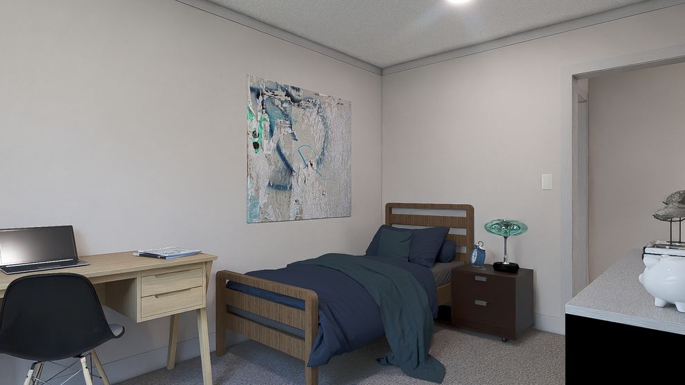 The JOHNNY B GOODE Guest Bedroom. This Manufactured Mobile Home features 3 bedrooms and 2 baths.