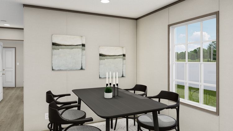 The LEGEND ANNIVERSARY 16X76 Dining Room. This Manufactured Mobile Home features 3 bedrooms and 2 baths.