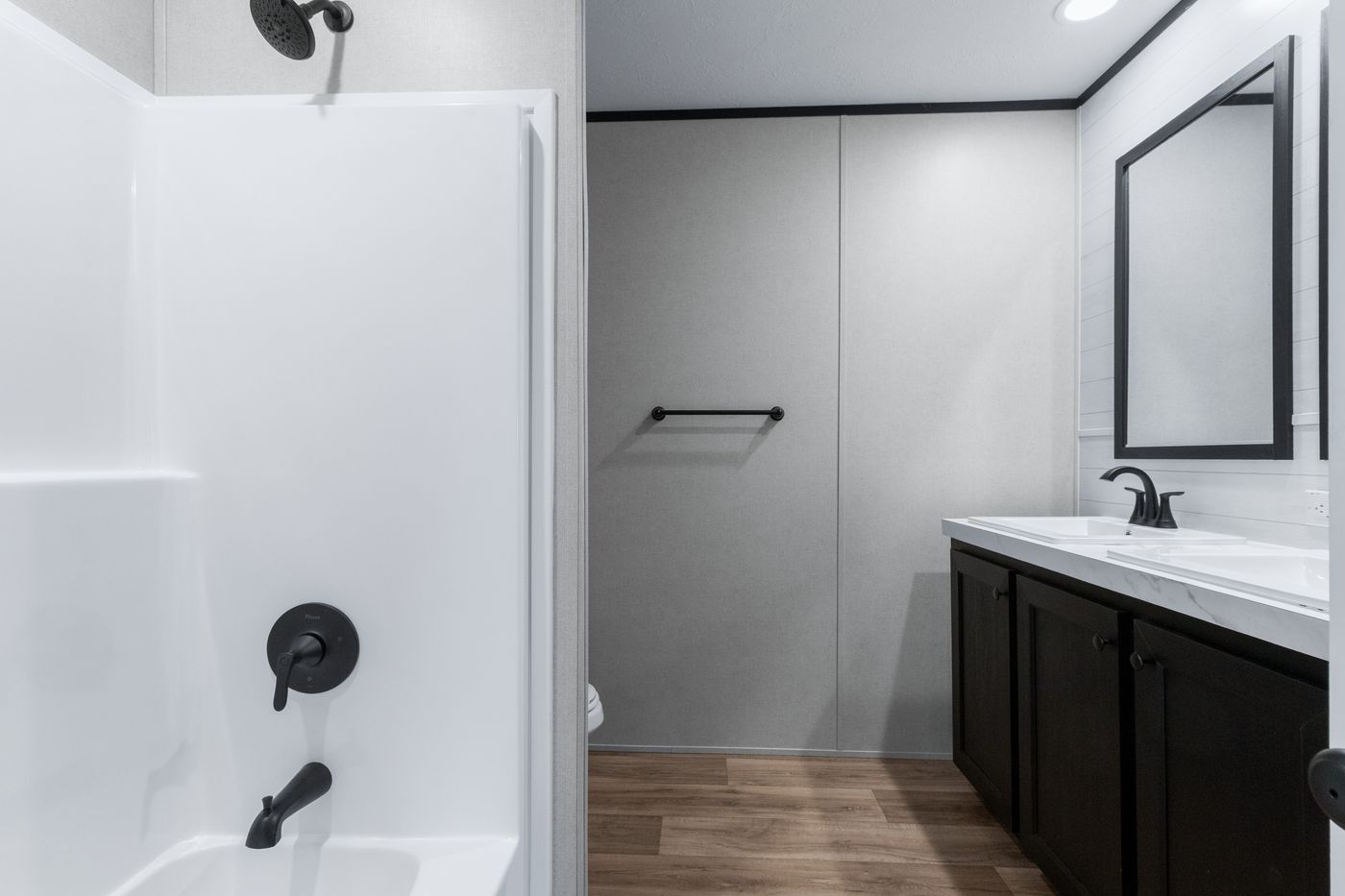The ABSOLUTE VALUE Guest Bathroom. This Manufactured Mobile Home features 4 bedrooms and 2 baths.