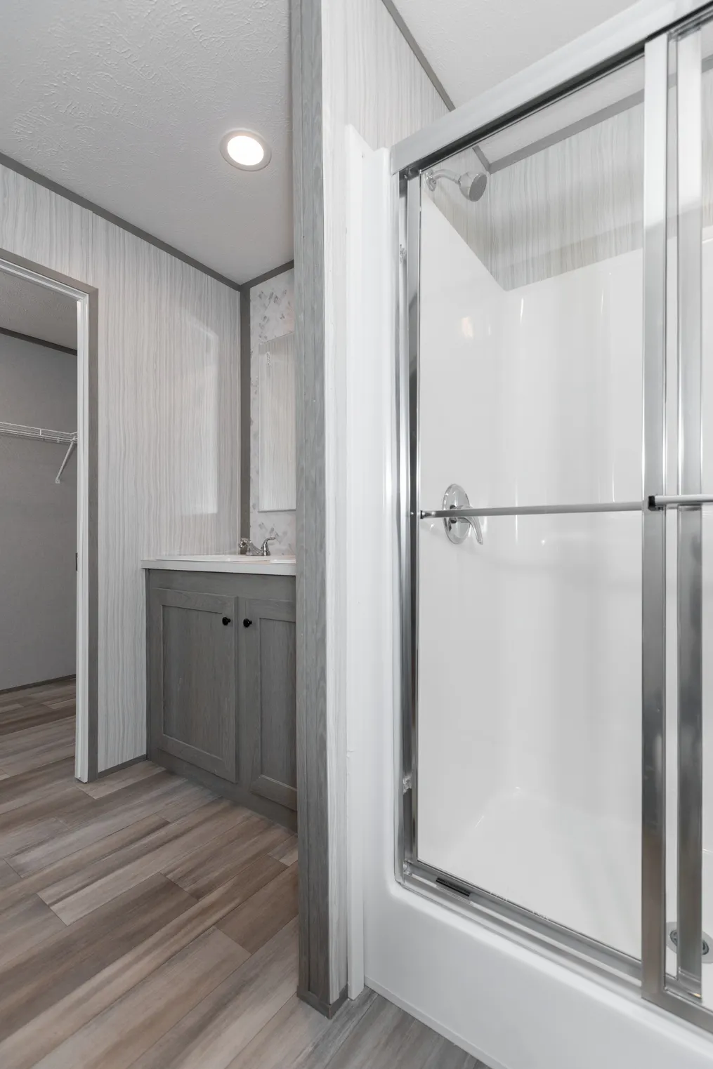 The THE SOCIAL 76 Primary Bathroom. This Manufactured Mobile Home features 3 bedrooms and 2 baths.