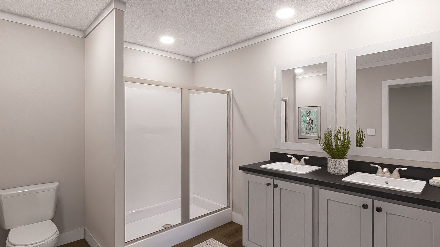 The SWEET CAROLINE Primary Bathroom. This Manufactured Mobile Home features 3 bedrooms and 2 baths.