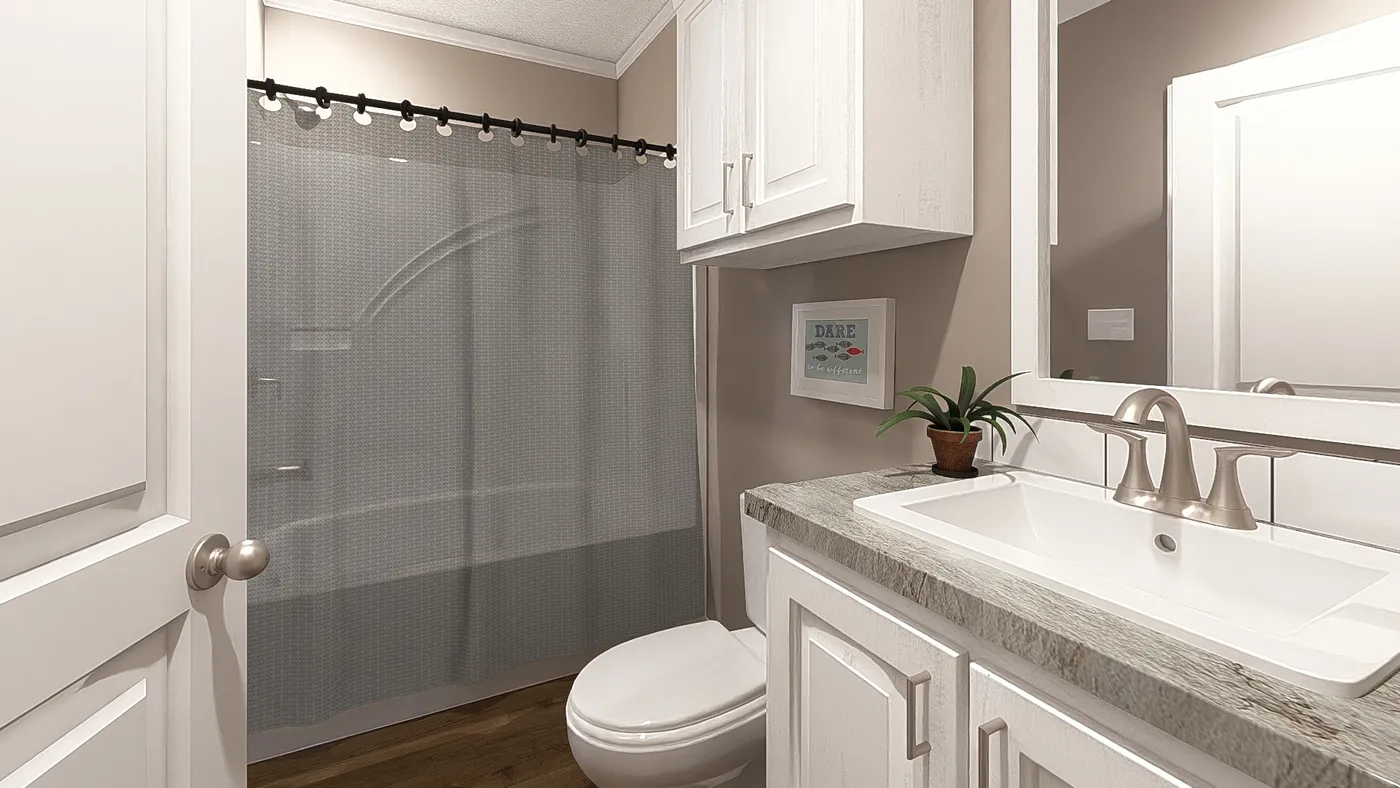 The THE ABIGAIL II Guest Bathroom. This Manufactured Mobile Home features 3 bedrooms and 2 baths.