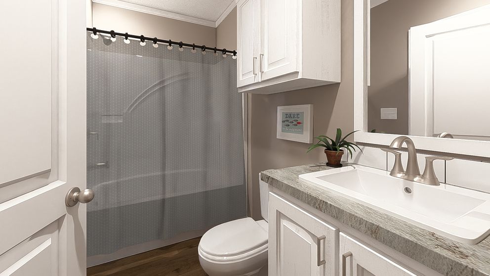 The THE ABIGAIL II Guest Bathroom. This Manufactured Mobile Home features 3 bedrooms and 2 baths.