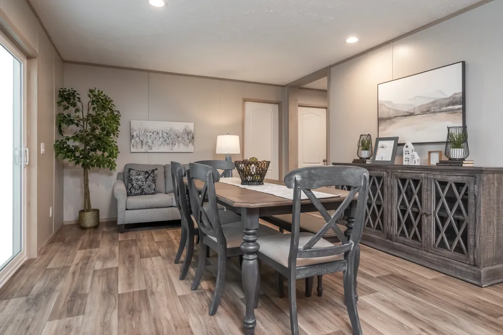 The BOONE Dining Room. This Manufactured Mobile Home features 4 bedrooms and 2 baths.