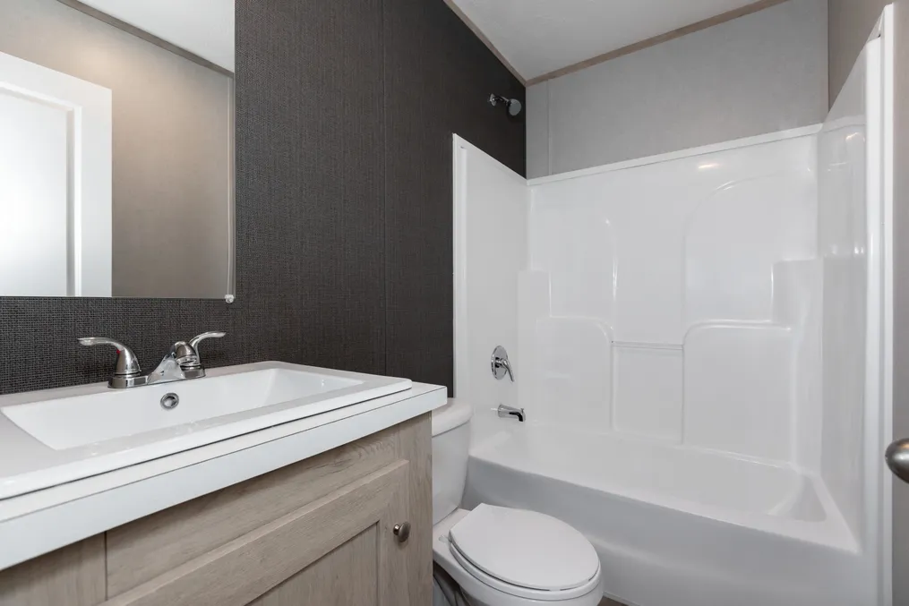 The THE SHOWER HOUSE 2.0 Guest Bathroom. This Manufactured Mobile Home features 3 bedrooms and 2 baths.