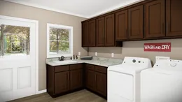 The THE BRYANT Utility Room. This Manufactured Mobile Home features 4 bedrooms and 2 baths.