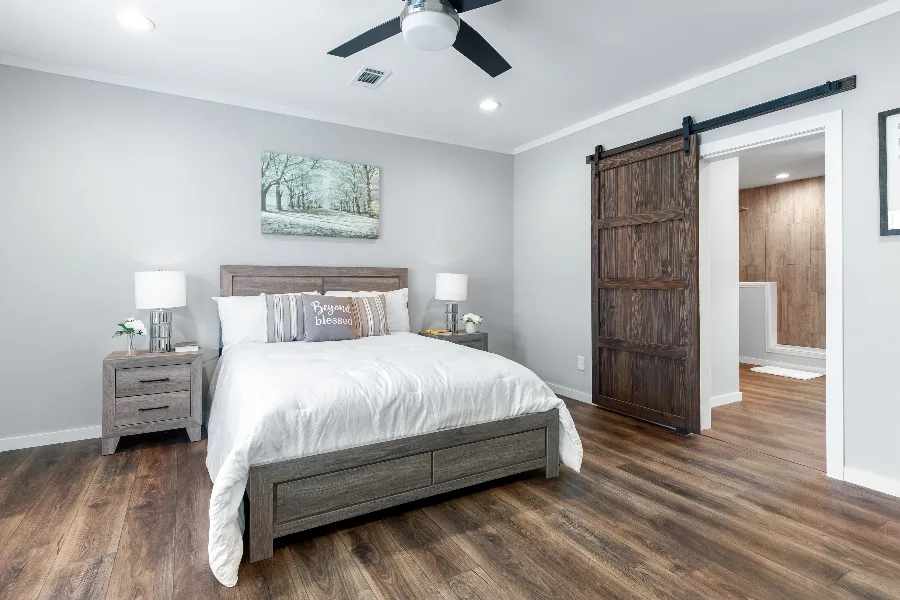 The THE SEDONA 4 Primary Bedroom. This Manufactured Mobile Home features 4 bedrooms and 2 baths.