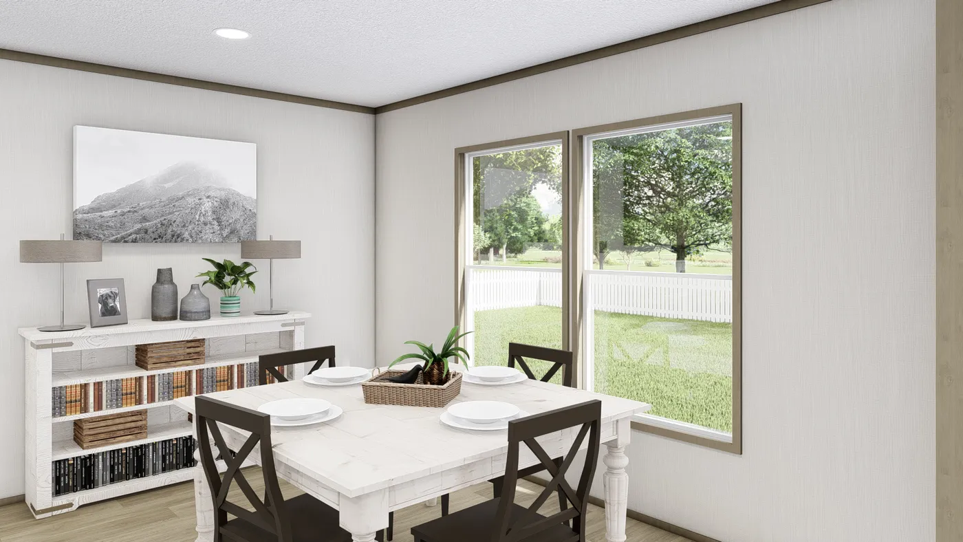 The COOK Dining Room. This Manufactured Mobile Home features 3 bedrooms and 2 baths.