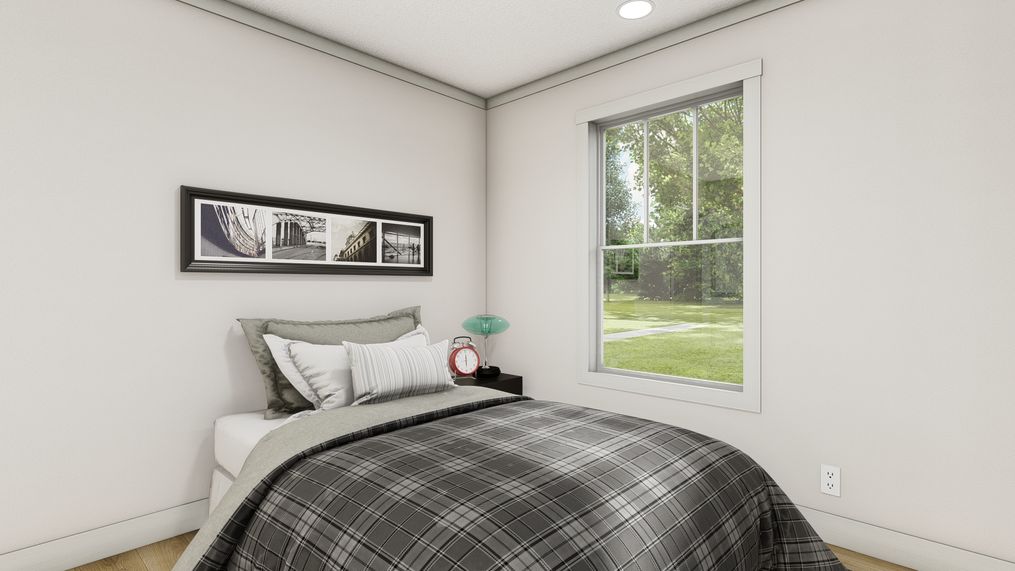 The 1440 IMAGINE Primary Bedroom. This Manufactured Mobile Home features 1 bedroom and 1 bath.