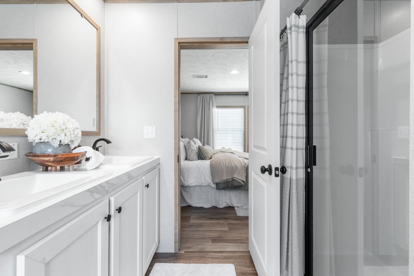The THE REAL DEAL Primary Bathroom. This Manufactured Mobile Home features 3 bedrooms and 2 baths.