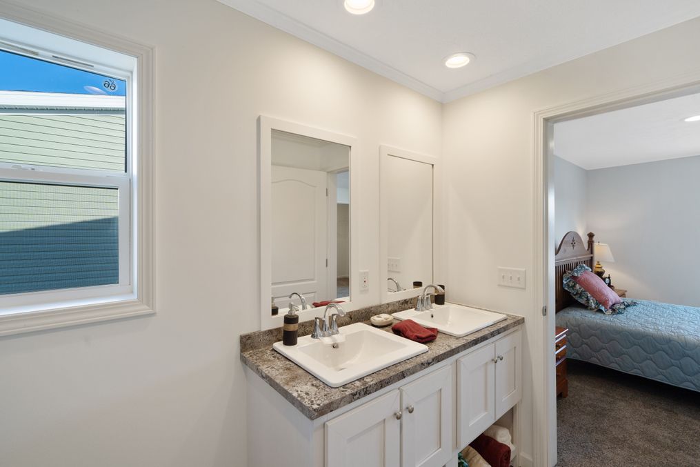 The LEHIGH 5628-1965 Primary Bathroom. This Manufactured Mobile Home features 3 bedrooms and 2 baths.