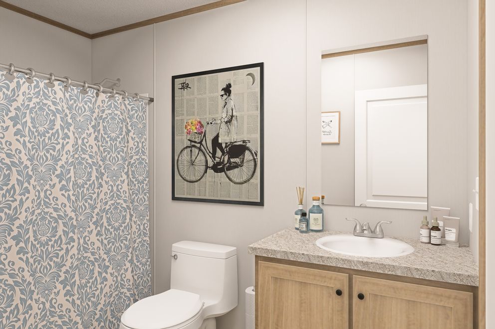 The THE EAGLE 60 Guest Bathroom. This Manufactured Mobile Home features 3 bedrooms and 2 baths.