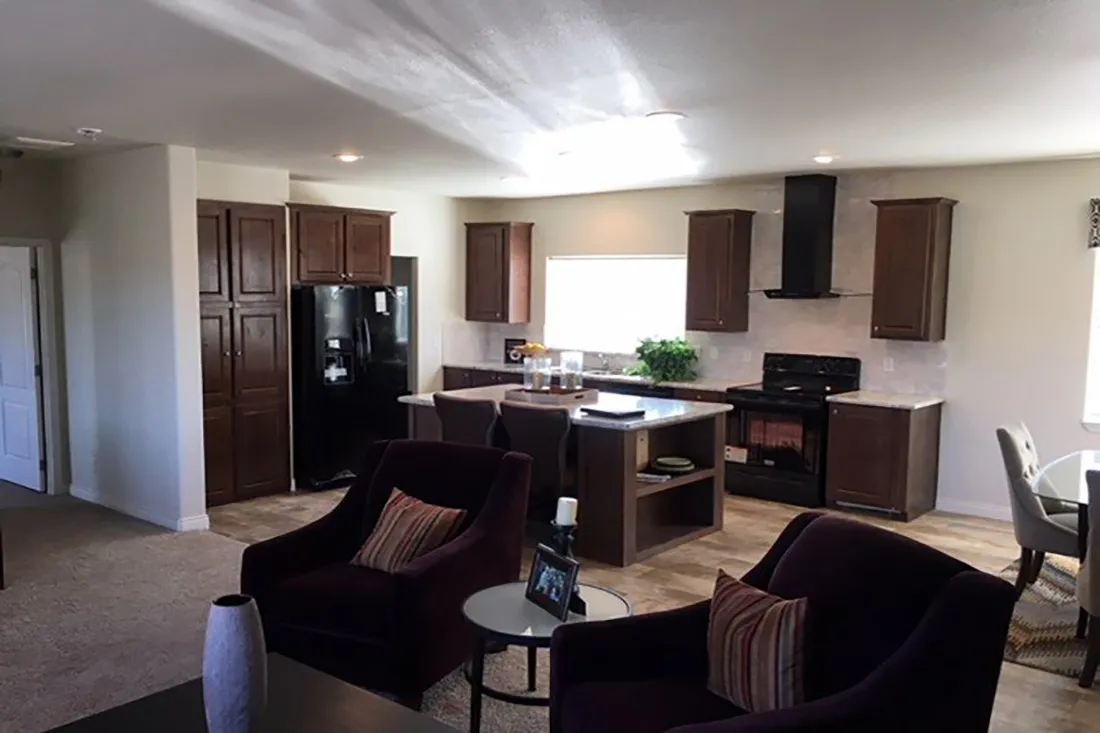 The 2024 COLUMBIA RIVER (NEW) Living Room. This Manufactured Mobile Home features 3 bedrooms and 2 baths.