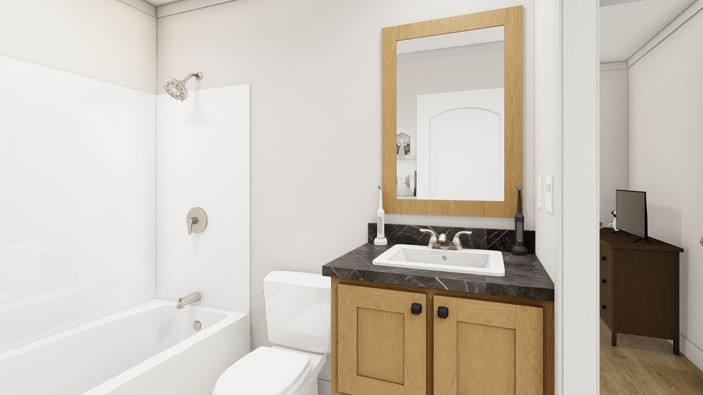 The RHYTHM NATION Guest Bathroom. This Manufactured Mobile Home features 3 bedrooms and 2 baths.