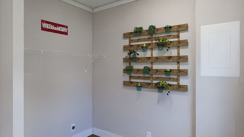 The STILL THE ONE Utility Room. This Manufactured Mobile Home features 2 bedrooms and 2 baths.