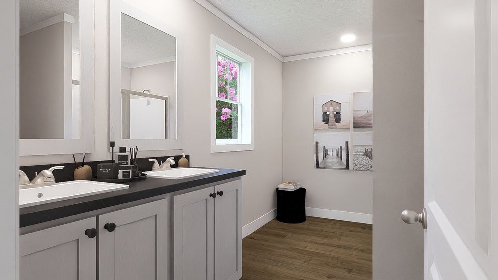 The BROWN EYED GIRL Primary Bathroom. This Manufactured Mobile Home features 4 bedrooms and 2 baths.
