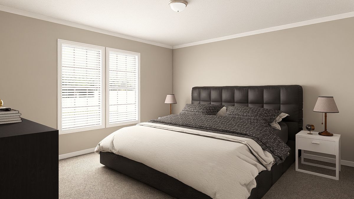 The THE BIG EASY Primary Bedroom. This Manufactured Mobile Home features 4 bedrooms and 3 baths.