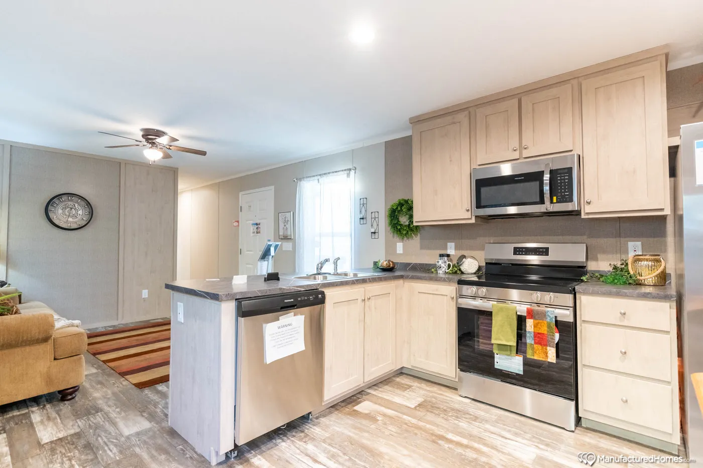 The TOPAZ 70 Kitchen. This Manufactured Mobile Home features 3 bedrooms and 2 baths.