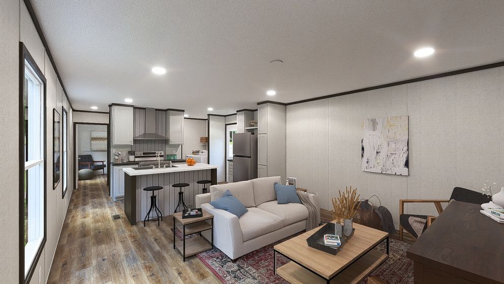 The DYNAMIC Living Room. This Manufactured Mobile Home features 3 bedrooms and 2 baths.