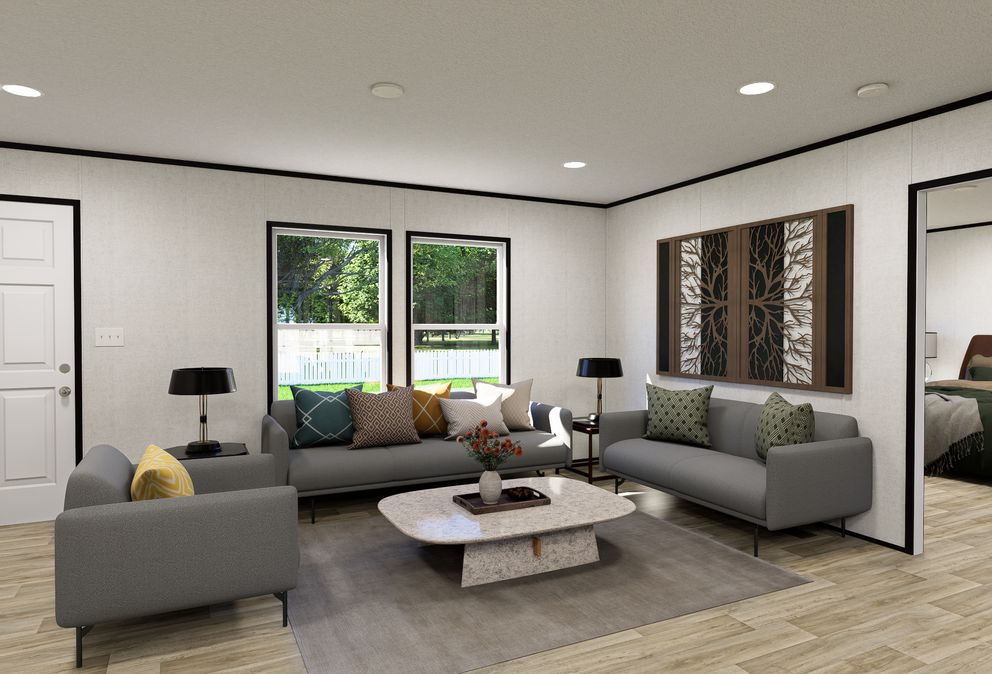 The ECLIPSE Living Room. This Manufactured Mobile Home features 4 bedrooms and 2 baths.