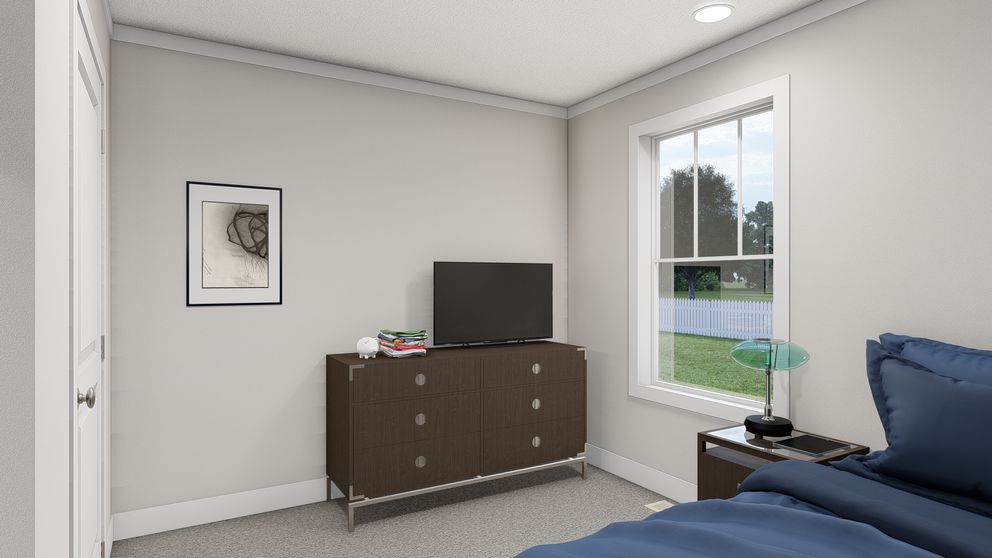 The THREE LITTLE BIRDS Guest Bedroom. This Manufactured Mobile Home features 3 bedrooms and 2 baths.