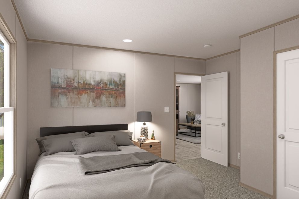 The THE EAGLE 68 Guest Bedroom. This Manufactured Mobile Home features 4 bedrooms and 2 baths.