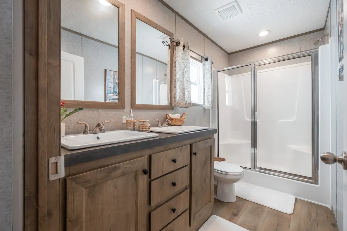 The WARRIOR II Primary Bathroom. This Manufactured Mobile Home features 2 bedrooms and 2 baths.