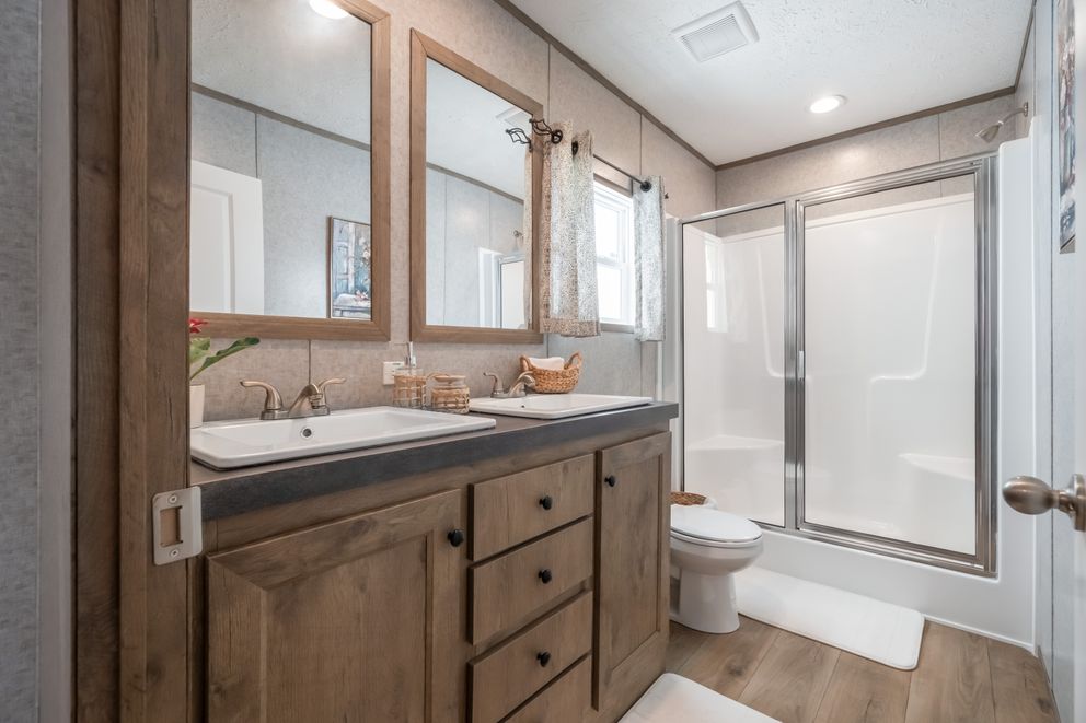 The WARRIOR II Primary Bathroom. This Manufactured Mobile Home features 2 bedrooms and 2 baths.