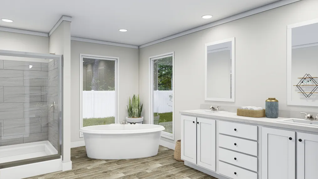 The COUNTRY AIRE Primary Bathroom. This Manufactured Mobile Home features 3 bedrooms and 3 baths.