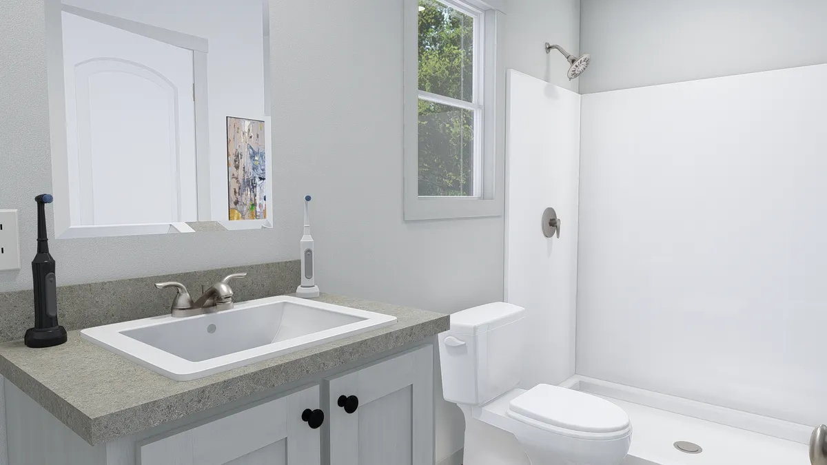 The STILL THE ONE Primary Bathroom. This Manufactured Mobile Home features 2 bedrooms and 2 baths.