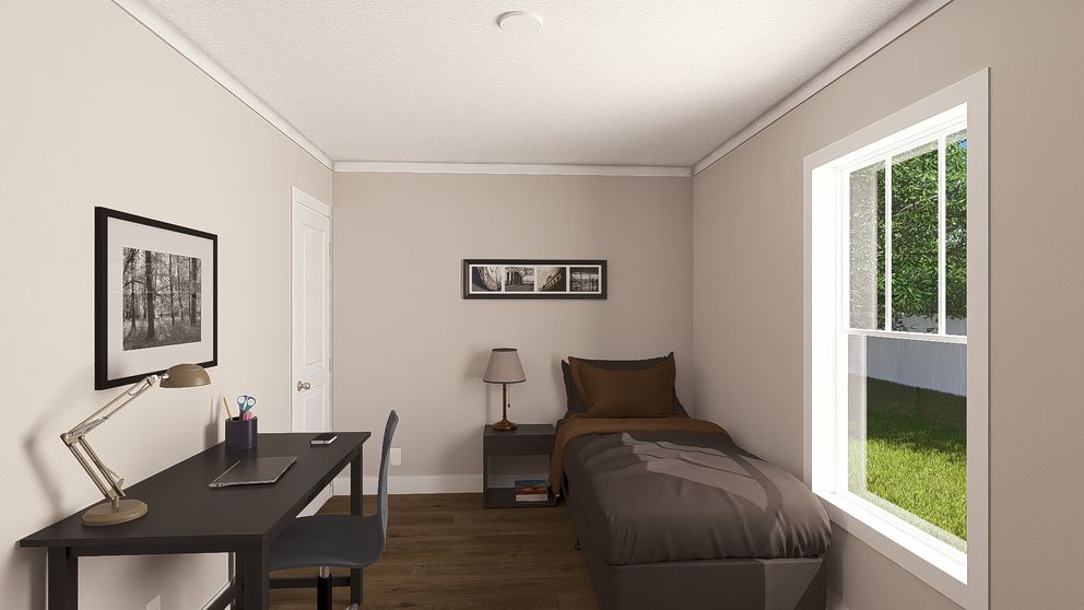 The SWEET CAROLINE Guest Bedroom. This Manufactured Mobile Home features 3 bedrooms and 2 baths.