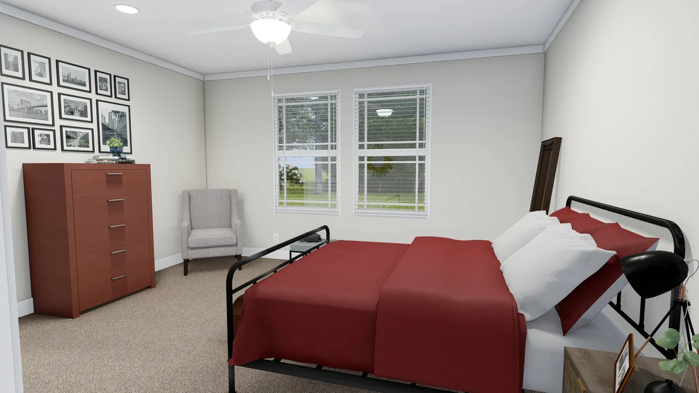 The SUNDANCE 48B Primary Bedroom. This Manufactured Mobile Home features 3 bedrooms and 2 baths.