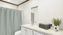 The DISCOVER Guest Bathroom. This Manufactured Mobile Home features 3 bedrooms and 2 baths.