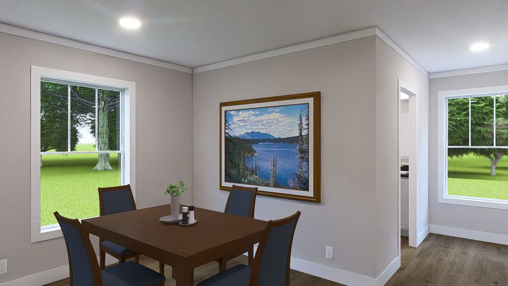 The LET IT BE Dining Room. This Manufactured Mobile Home features 3 bedrooms and 2 baths.