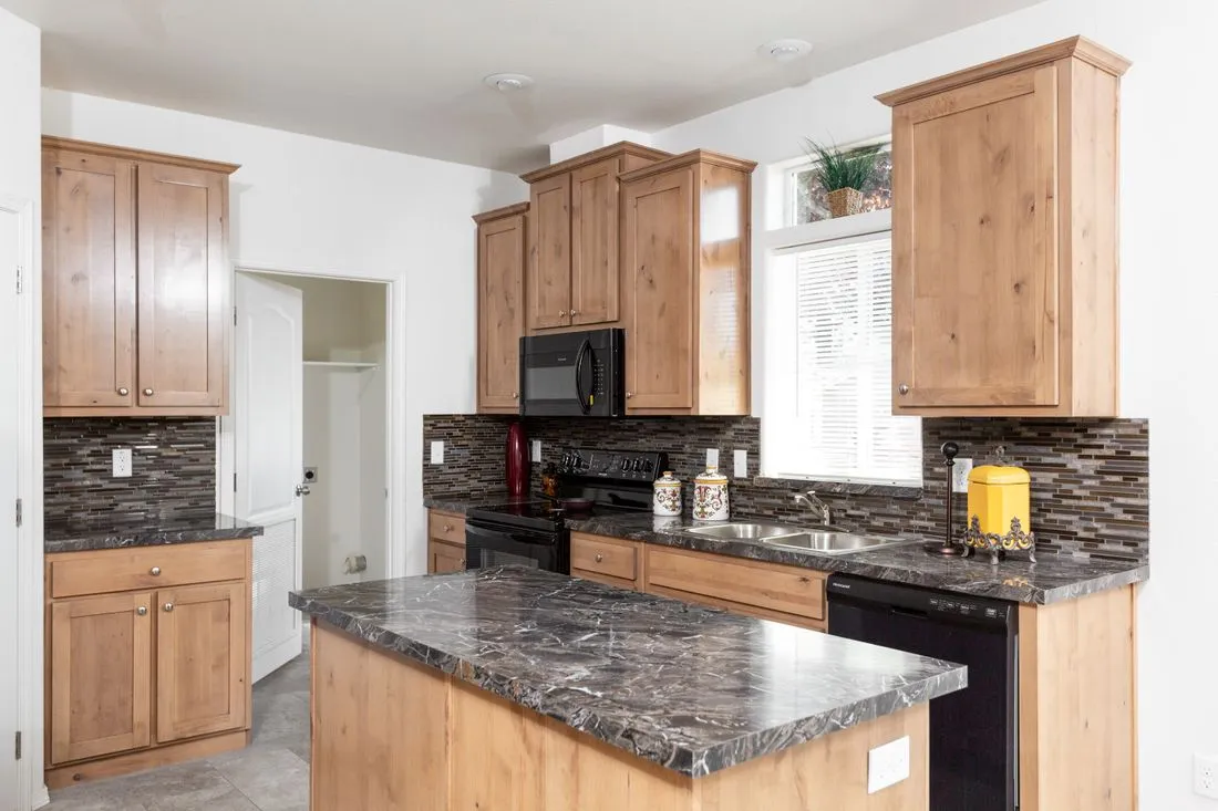 The 2025 COLUMBIA RIVER (NEW) Kitchen. This Manufactured Mobile Home features 4 bedrooms and 2 baths.