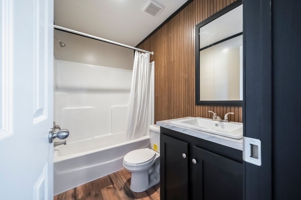 The RAVENWOOD Guest Bathroom. This Manufactured Mobile Home features 3 bedrooms and 2 baths.
