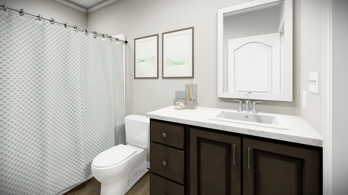 The HUXTON II Guest Bathroom. This Manufactured Mobile Home features 4 bedrooms and 2 baths.