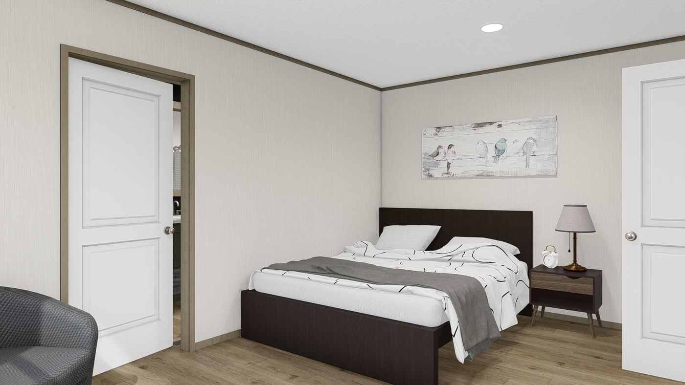 The HUDSON Primary Bedroom. This Manufactured Mobile Home features 3 bedrooms and 2 baths.