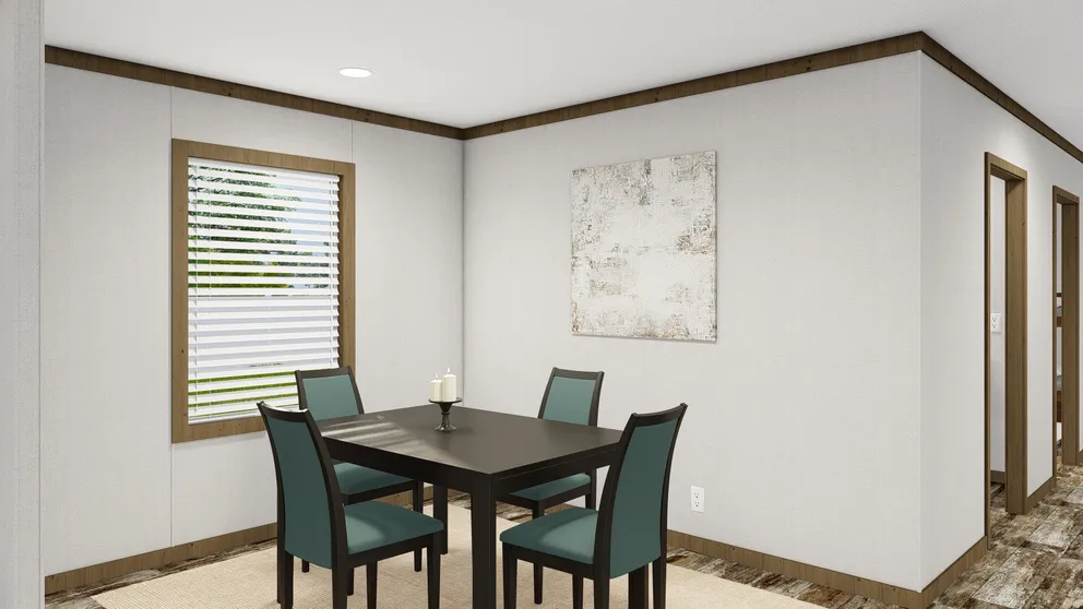 The HOMESTEAD BREEZE Dining Room. This Manufactured Mobile Home features 4 bedrooms and 2 baths.