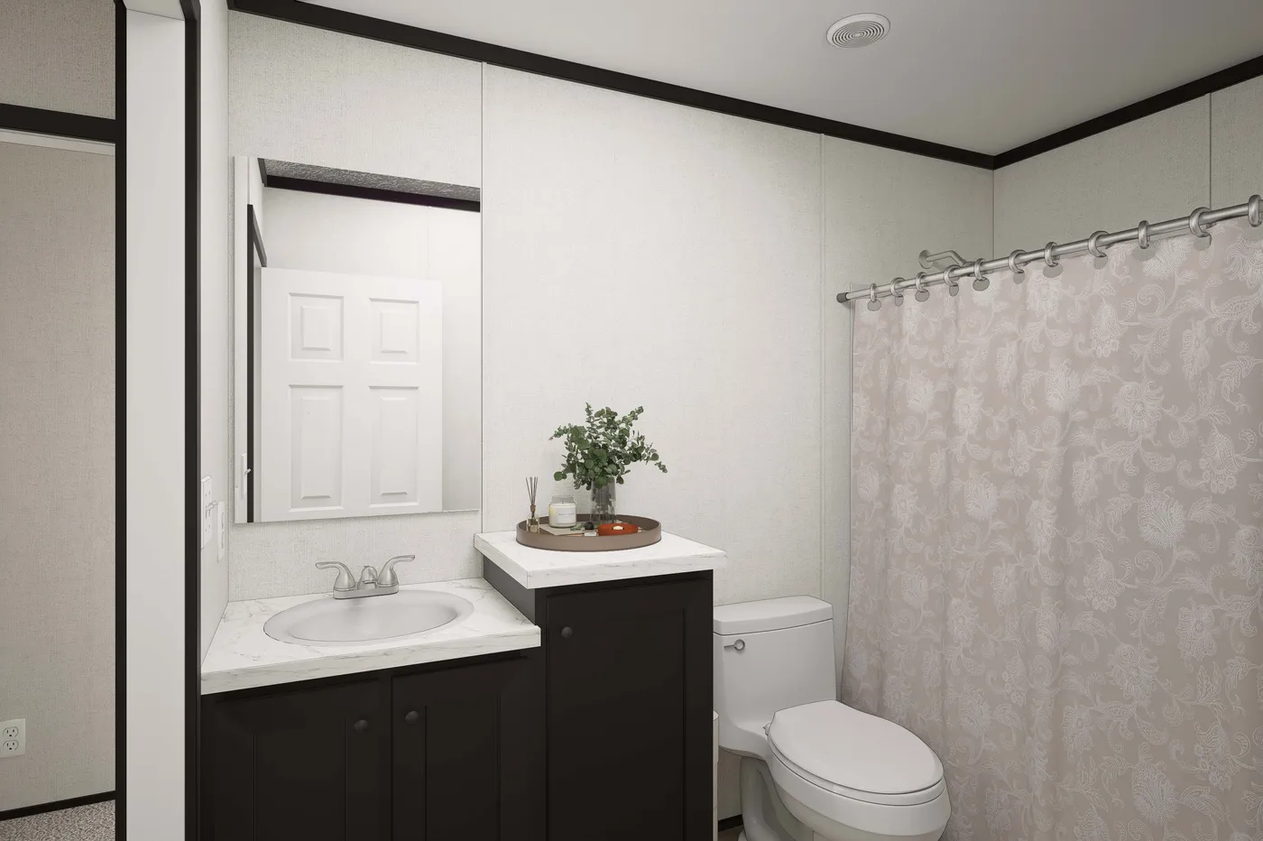 The PLATINUM ANNIVERSARY Guest Bathroom. This Manufactured Mobile Home features 3 bedrooms and 2 baths.